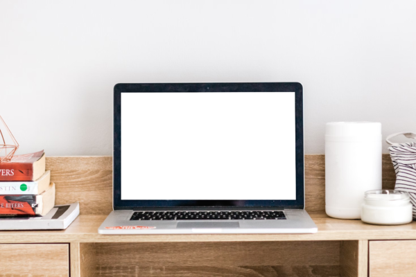 A laptop on a wooden table